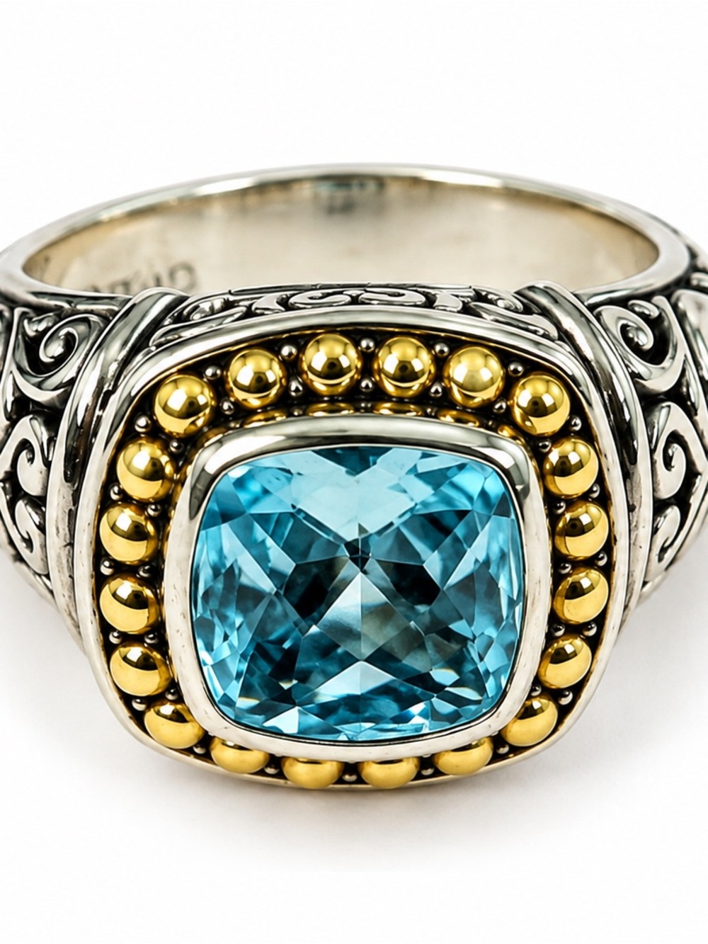 Sterling Silver Ring with Blue Topaz Center and Gold Accents